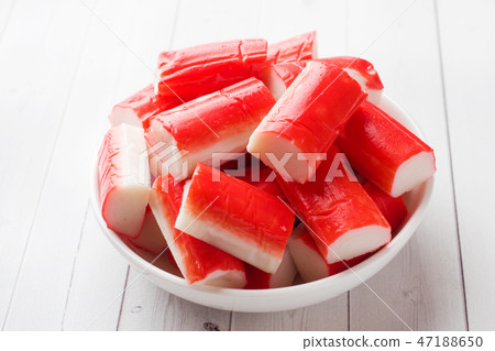 Salad crab sticks in a plate on a white table. Salad crab sticks in a plate on a white table. 47188650