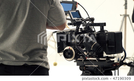 Behind video camera recording online commercial 47190309