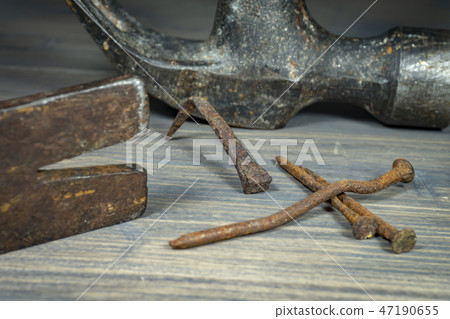 Old rusty nails with two claw hammers Old rusty nails with two claw hammers 47190655