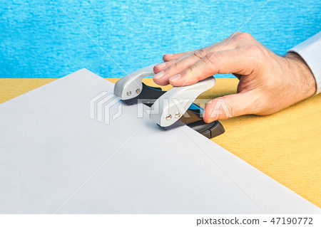 Punch for working with documents in office. Punch for working with documents in office. 47190772