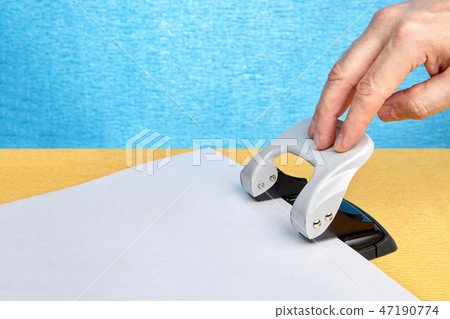Office hole punch for making holes in paper. 47190774