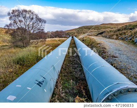 Pipeline of the Storr Lochs hydroelectric power station nestled under the mountains of the Pipeline of the Storr Lochs hydroelectric power station nestled under the mountains of the 47190833