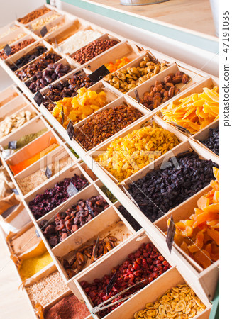Top view of various dry fruit, raisins and nuts at the shop 47191035