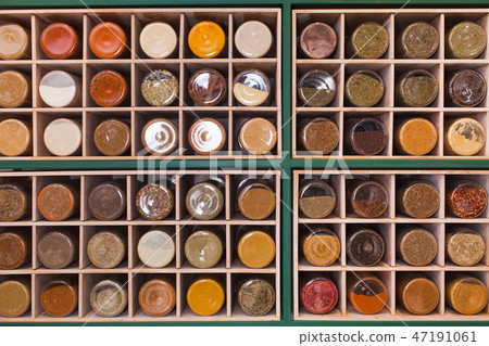 Shelf made of cubic cells filled with jars Shelf made of cubic cells filled with jars 47191061