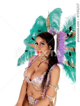 Beautiful woman in carnival costume in close up 47191217