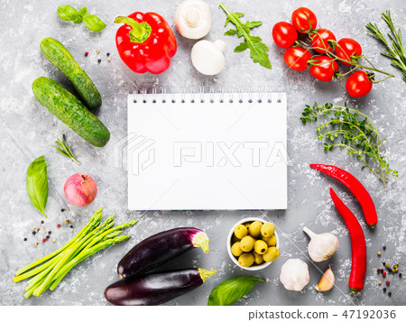 Notebook with vegetables and herbs on gray concrete background Notebook with vegetables and herbs on gray concrete background 47192036