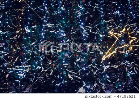Garland on a New Year tree in the form of a star. Happy New Year. Garland on a New Year tree in the form of a star. Happy New Year. 47192621