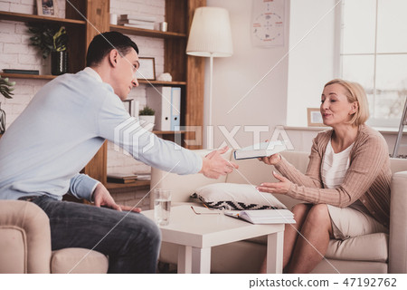 Pretty blonde female presenting her new book 47192762