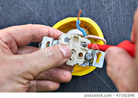 Assembling wall home power socket, close-up. Assembling wall home power socket, close-up. 47192896