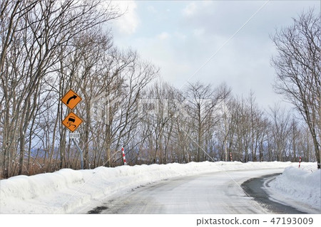 Snow road and sign curve Snow road and sign curve 47193009