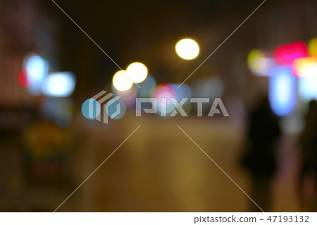 Defocused night city life scene - cars, people and street lamps, retro color Defocused night city life scene - cars, people and street lamps, retro color 47193132