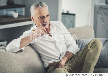 Busy businessman feeling thoughtful planning his day 47194028