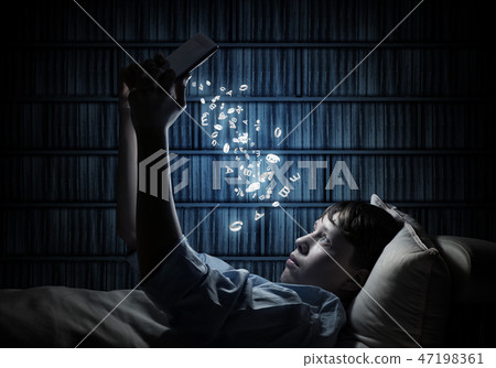 Reading in bed Reading in bed 47198361