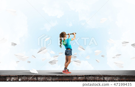 Concept of careless happy childhood with girl exploring this world 47199435