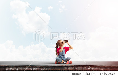 Concept of careless happy childhood with girl of school age looking in future Concept of careless happy childhood with girl of school age looking in future 47199632