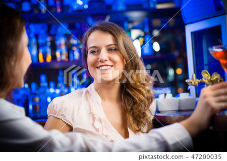 young woman in a bar 47200035