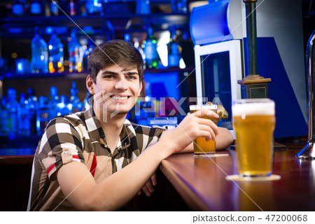 portrait of a young man at the bar portrait of a young man at the bar 47200068