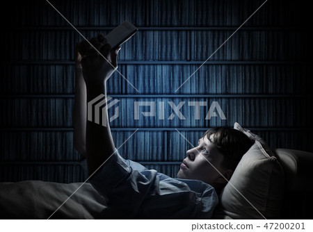 Reading in bed Reading in bed 47200201