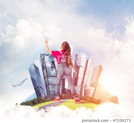 Concept of careless happy childhood with girl dreaming about fut Concept of careless happy childhood with girl dreaming about fut 47200273