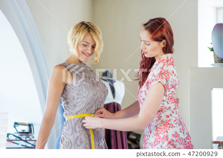 Dressmaker at work 47200929