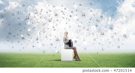 Attractive business lady or accountant outdoors on white box Attractive business lady or accountant outdoors on white box 47201514