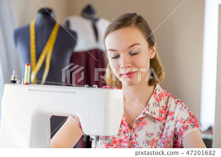 Seamstress at work 47201682