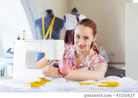 Seamstress at work Seamstress at work 47203617