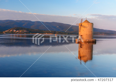 Old Spanish windmill in lagoon Orbetello Old Spanish windmill in lagoon Orbetello 47207317