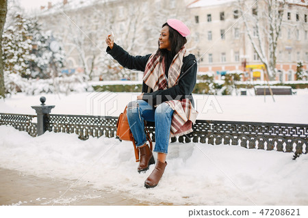 Elegant black girl in a winter city 47208621