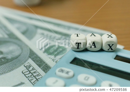 The tax wooden cubic on work table 47209586
