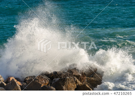 Sea waves break on the rocks - Liguria Italy Sea waves break on the rocks - Liguria Italy 47210265