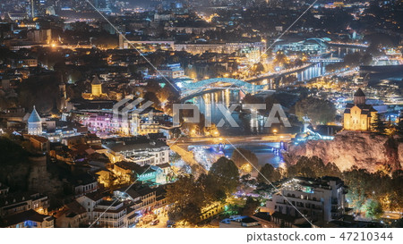 Tbilisi, Georgia. Top View Of Famous Landmarks In Evening Or Night Illuminations. Georgian Capital Tbilisi, Georgia. Top View Of Famous Landmarks In Evening Or Night Illuminations. Georgian Capital 47210344