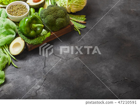 Assorted green toned raw organic vegetables  47210591