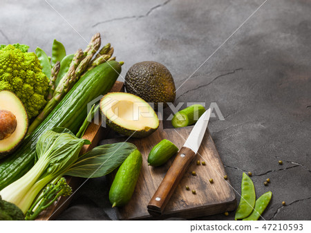 Assorted green toned raw organic vegetables 47210593