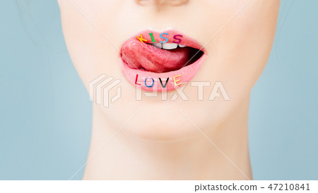 Sexy female lips with licking tongue closeup. Sexy female lips with licking tongue closeup. 47210841