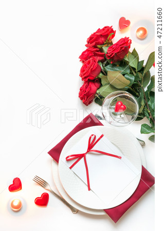 Valentine's day dinner.Table setting with red rose 47211660