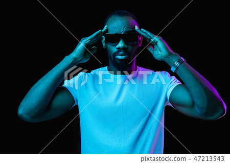 The neon portrait of a young smiling african man 47213543