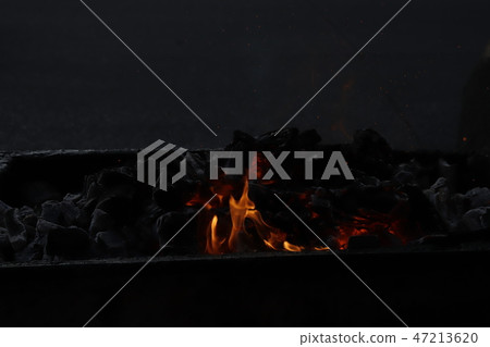 Charcoal fire. 47213620