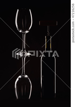 bottle red of wine with a glass on a black bottle red of wine with a glass on a black 47216256