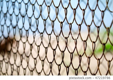Steel wire fence to prevent dangerous areas beach Steel wire fence to prevent dangerous areas beach 47219786