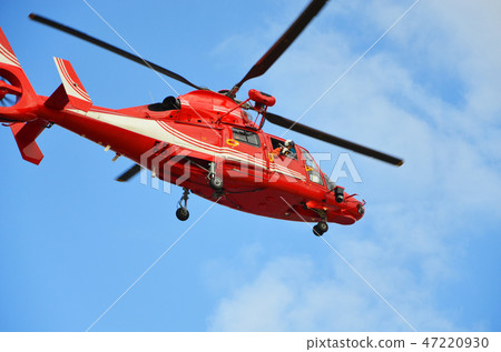 A firefighting and disaster prevention helicopter performing a demonstration flight at the New Year's parade 47220930