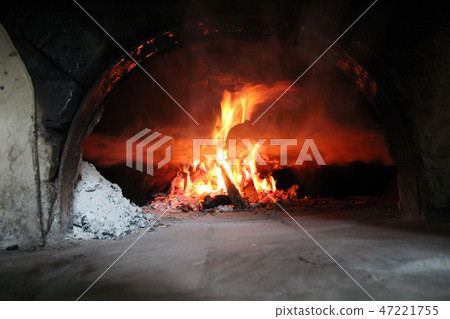 Fire wood brighly burning in furnace Fire wood brighly burning in furnace 47221755