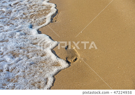 beach, wave and footprints at sunset time beach, wave and footprints at sunset time 47224938