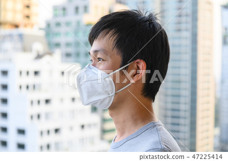 Asian man wear mask for air pollution Asian man wear mask for air pollution 47225414