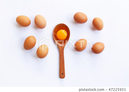 Chicken eggs with yolk on white background. Chicken eggs with yolk on white background. 47225931