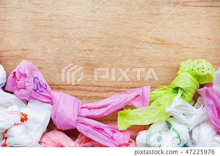 Plastic waste , Plastic bags on wooden background. Plastic waste , Plastic bags on wooden background. 47225976