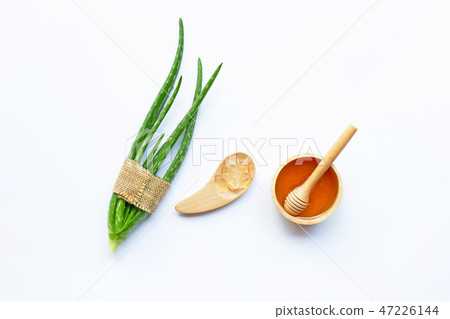 Wooden bowl of honey and aloe vera. 47226144