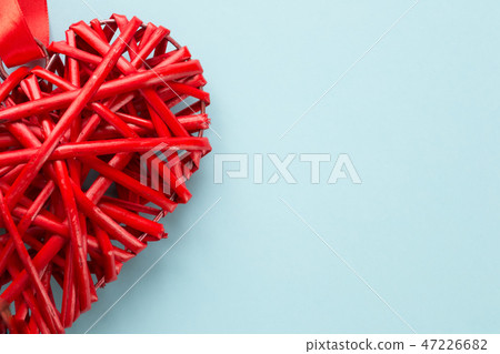 Red heart wicker rattan on blue background Red heart wicker rattan on blue background 47226682