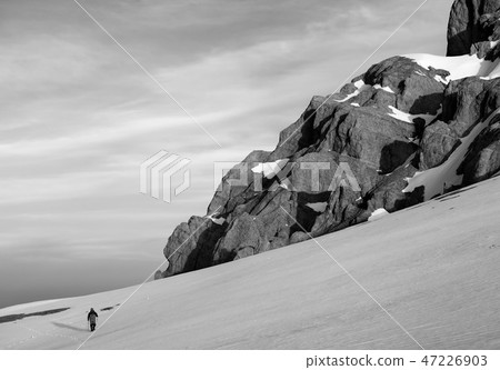 Hiker at snowy mountains Hiker at snowy mountains 47226903