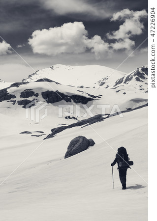 Hiker in snow mountains Hiker in snow mountains 47226904